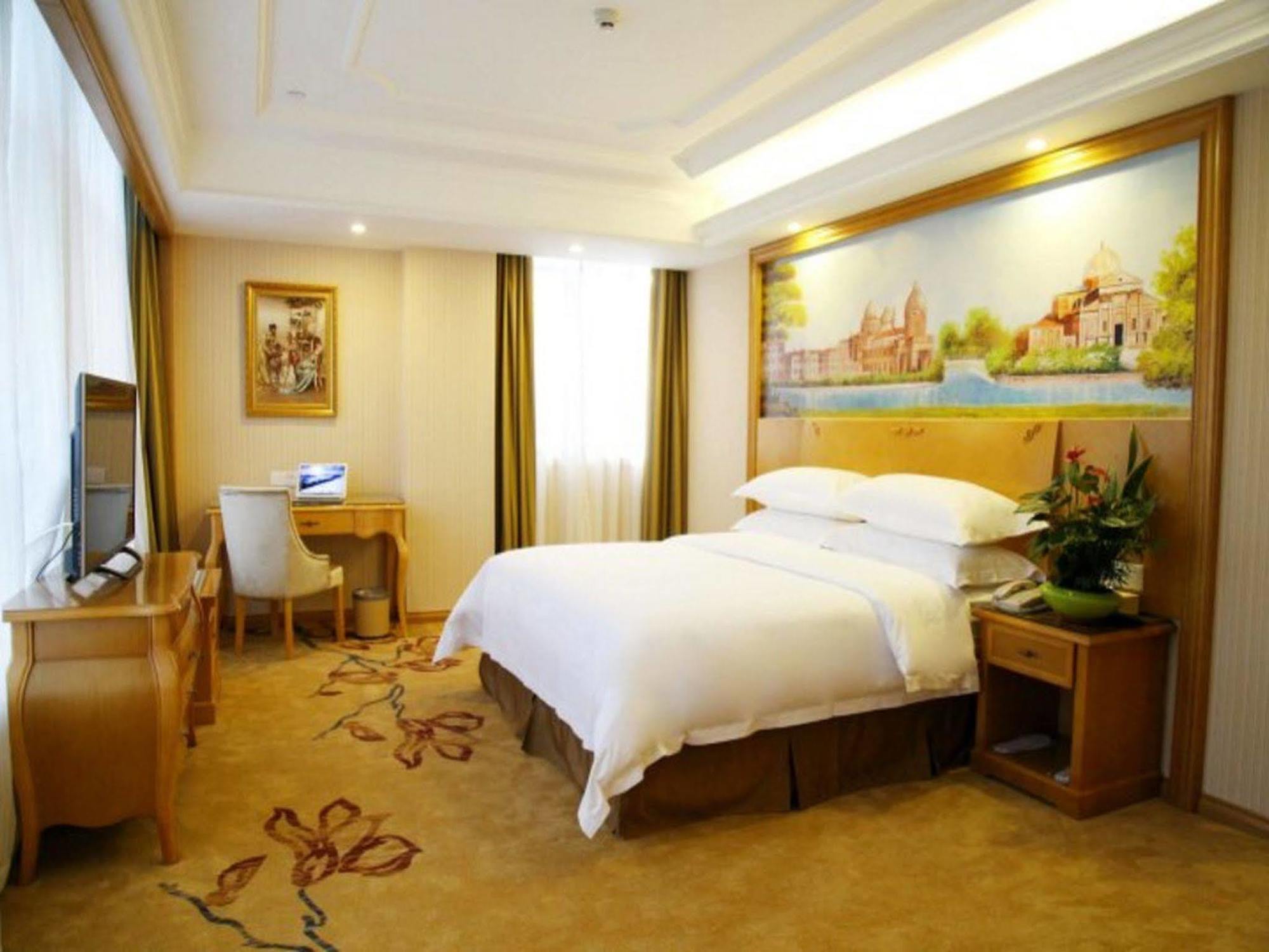Vienna International Hotel Meizhou Spindle Bridge Branch Bagian luar foto